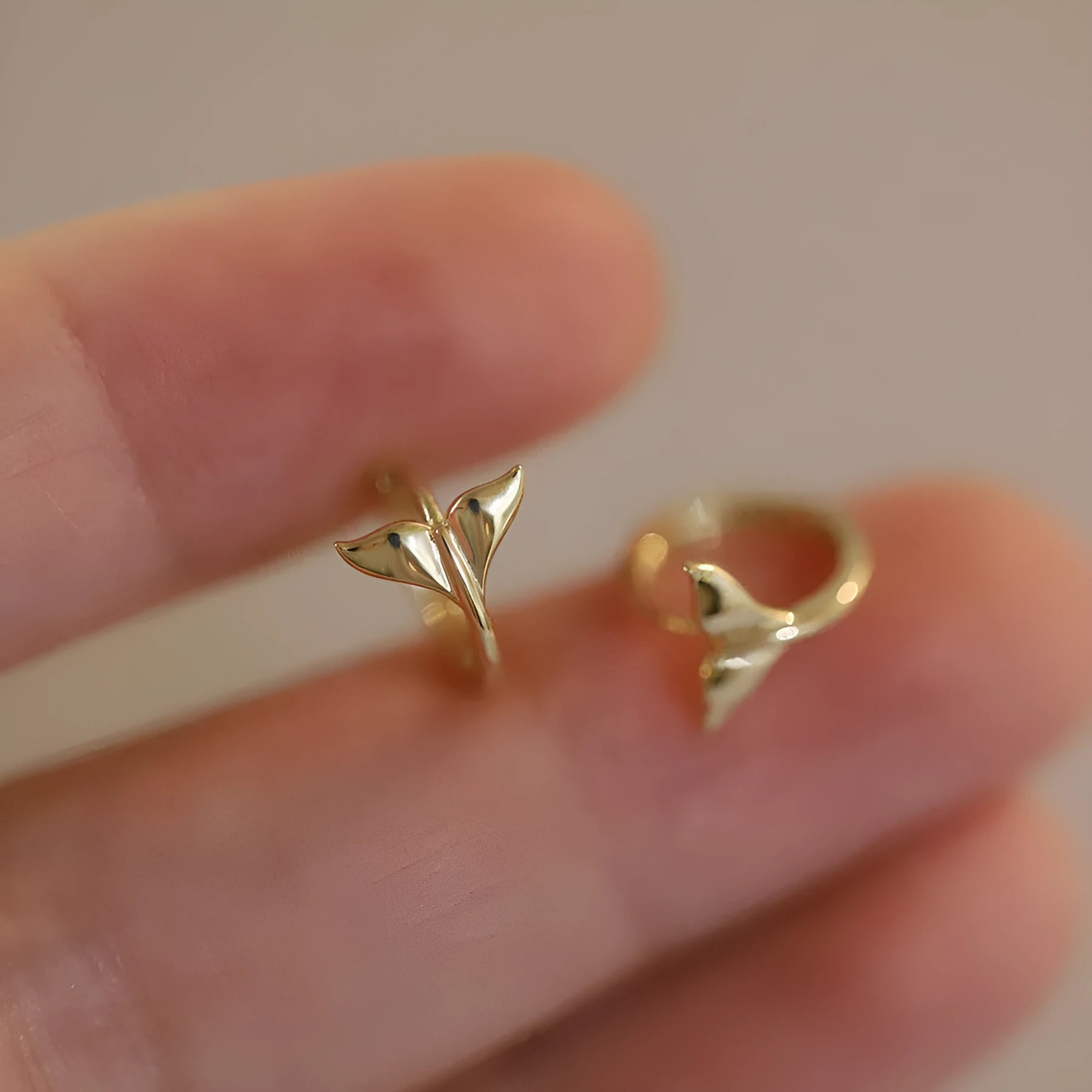 S925 sterling silver fishtail earrings with 14k gold plating in gold and white gold colours.