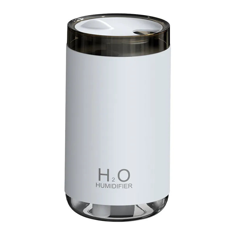 USB jellyfish humidifier creating smoke ring mist patterns with warm night light illumination