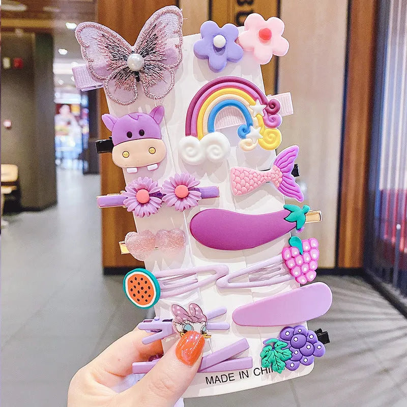 14-piece toddler hair accessories set on display including rainbow barrettes, fruit clips, and butterfly pins in bright colours