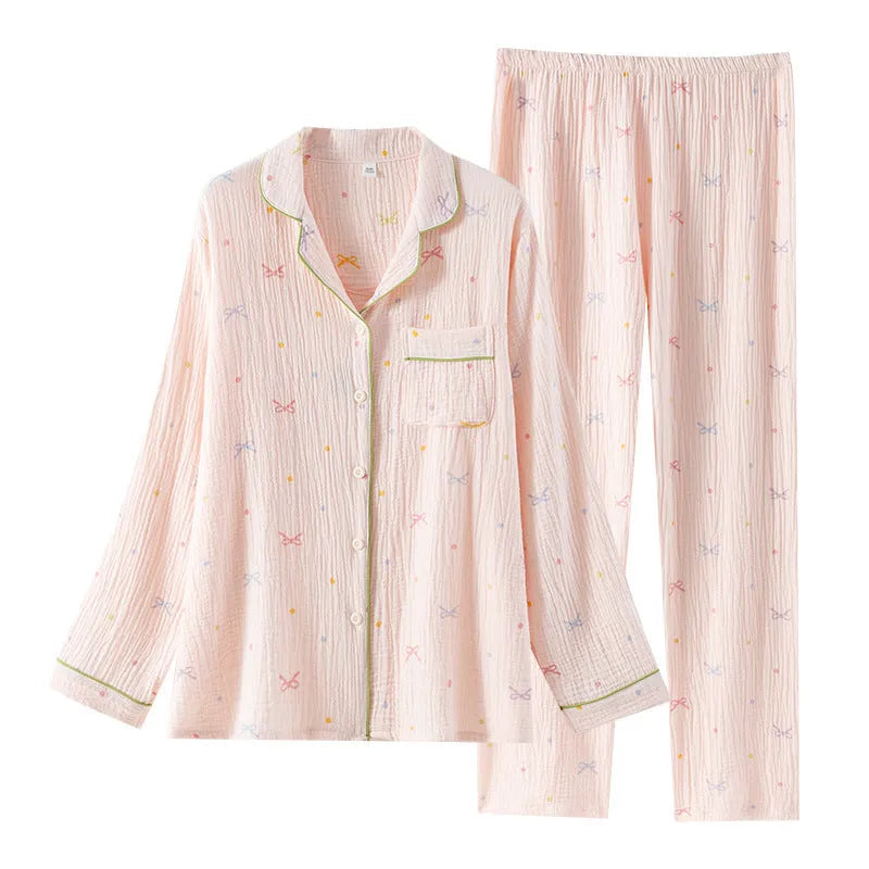 Women's long sleeve cotton pyjama set in pink, featuring a simple casual style top and trousers.