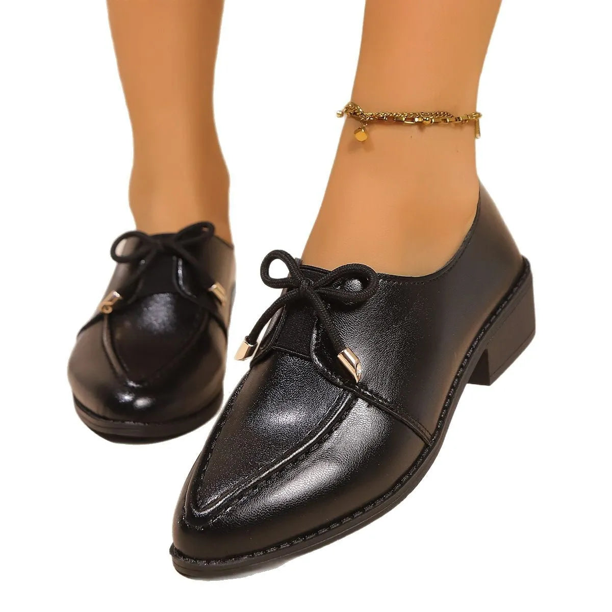 Women's British-style leather shoes with decorative bow detailing on PU upper and rubber sole