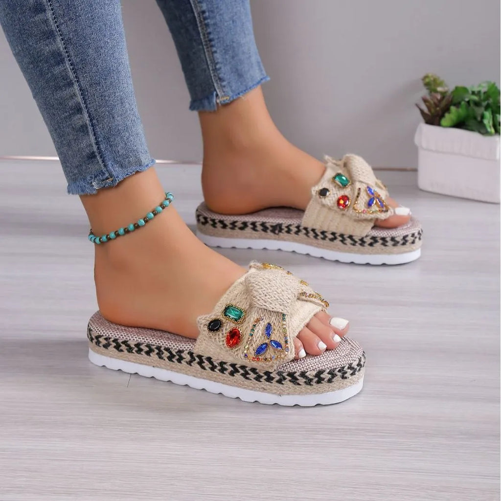 Beige women's platform sandals with bow detail, round toe, and cloth upper