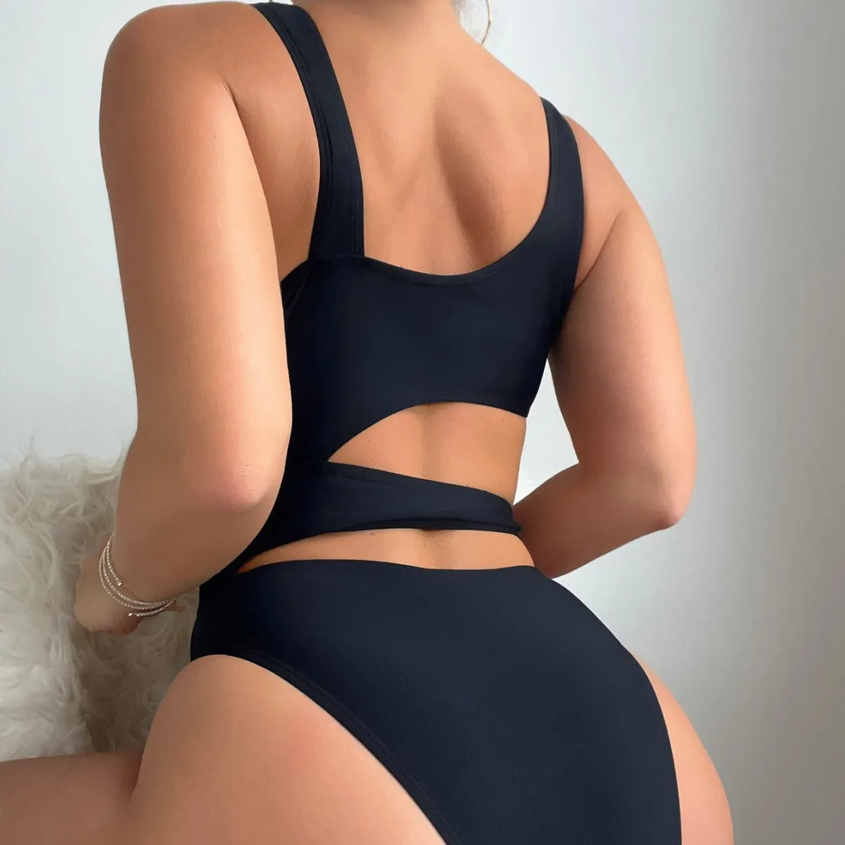 Black solid colour high cut hollow detail one-piece swimsuit for adult women