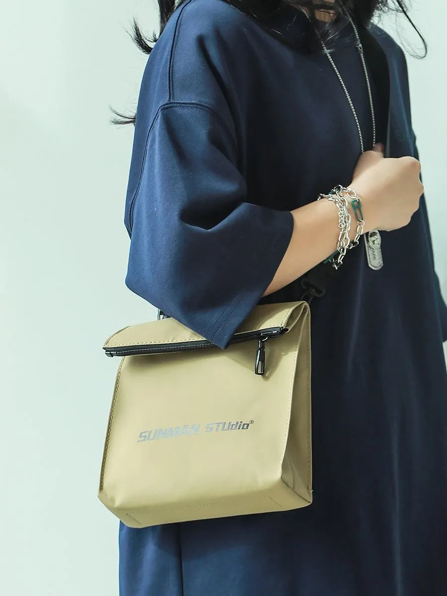 Simple all-match messenger bag design backpack in khaki with sewing line detail and adjustable crossbody strap