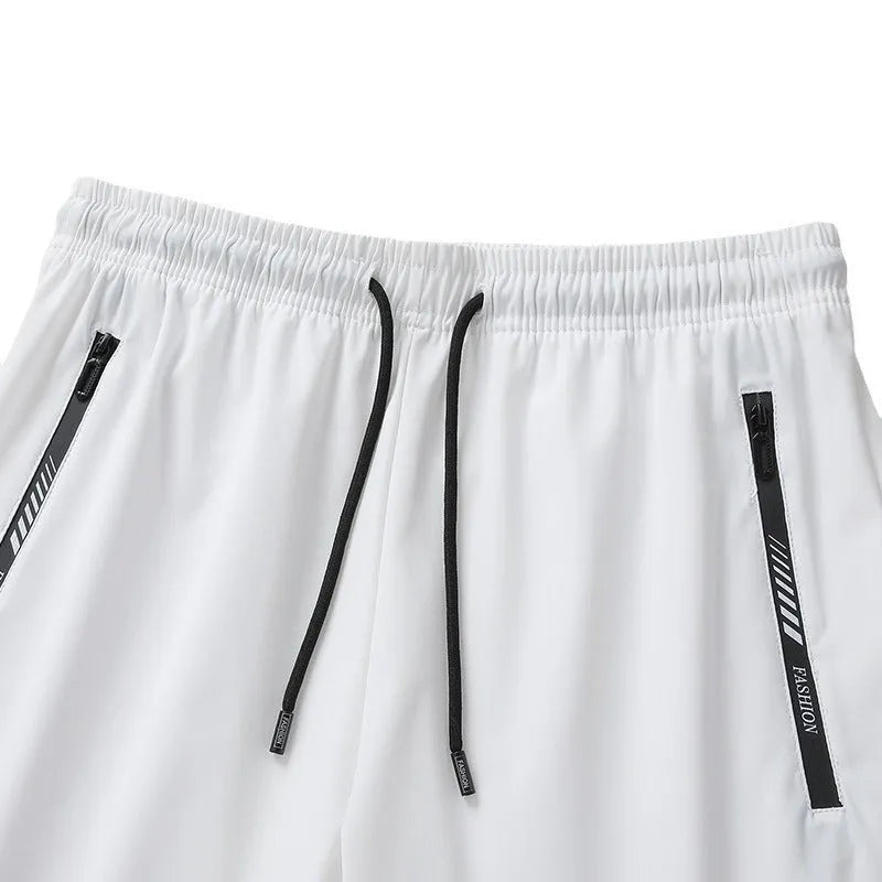 Men's black nylon quick-drying sports shorts with loose fit and elastic waistband.