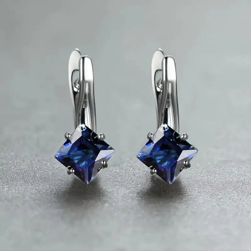Copper women's earrings with inlaid zircon diamond design in blue, green, or colour variants.