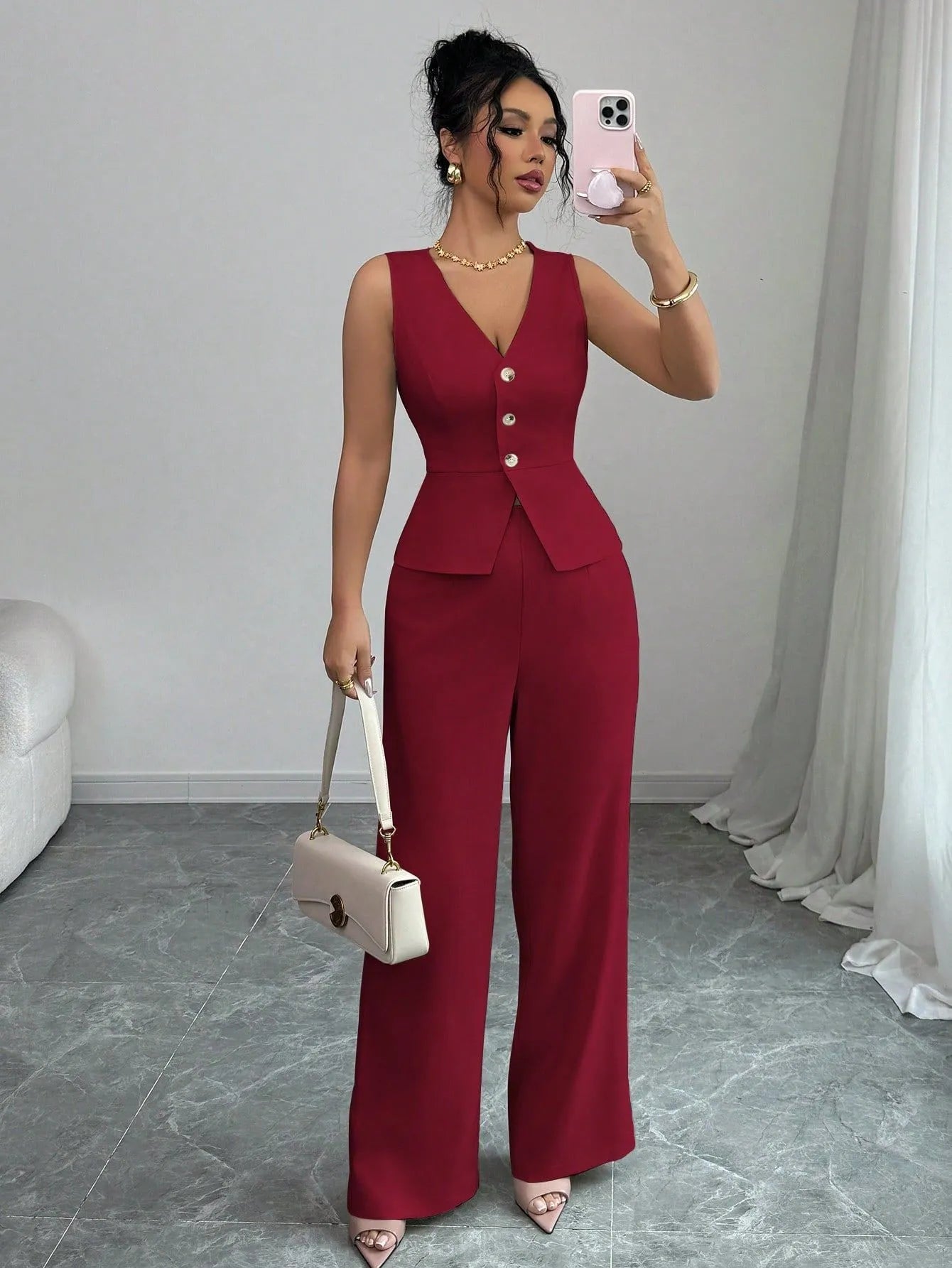 Women's black sleeveless vest and high waist trousers two-piece casual set.