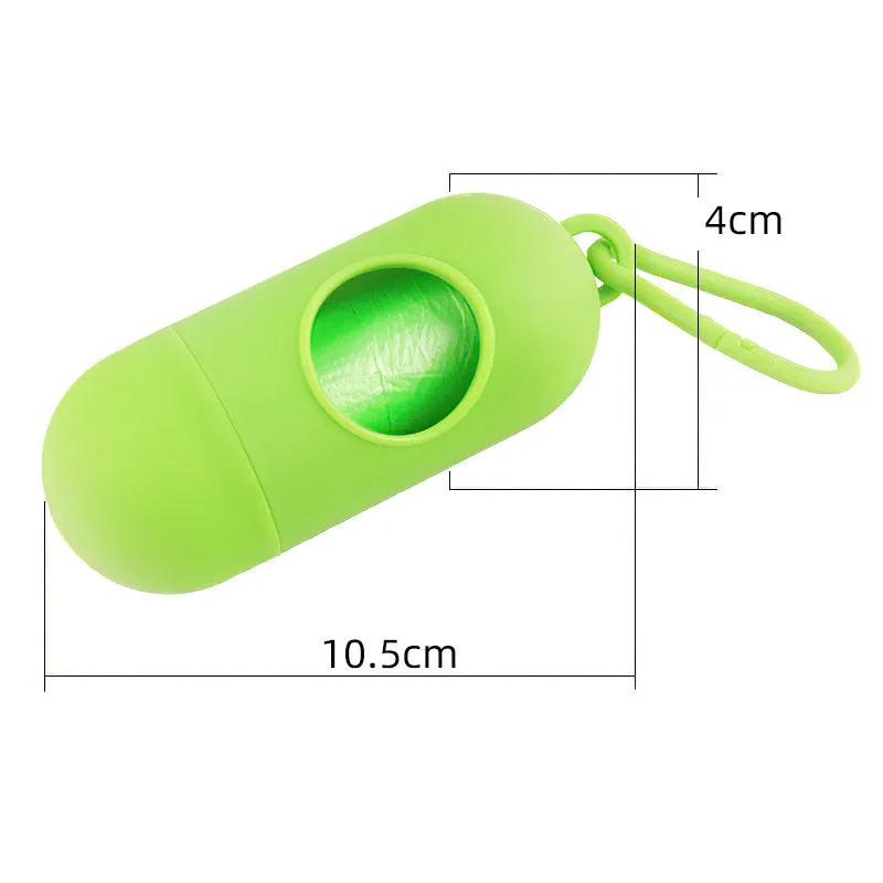 Compact black dog waste bag dispenser with a side hook and Velcro strap for attachment.