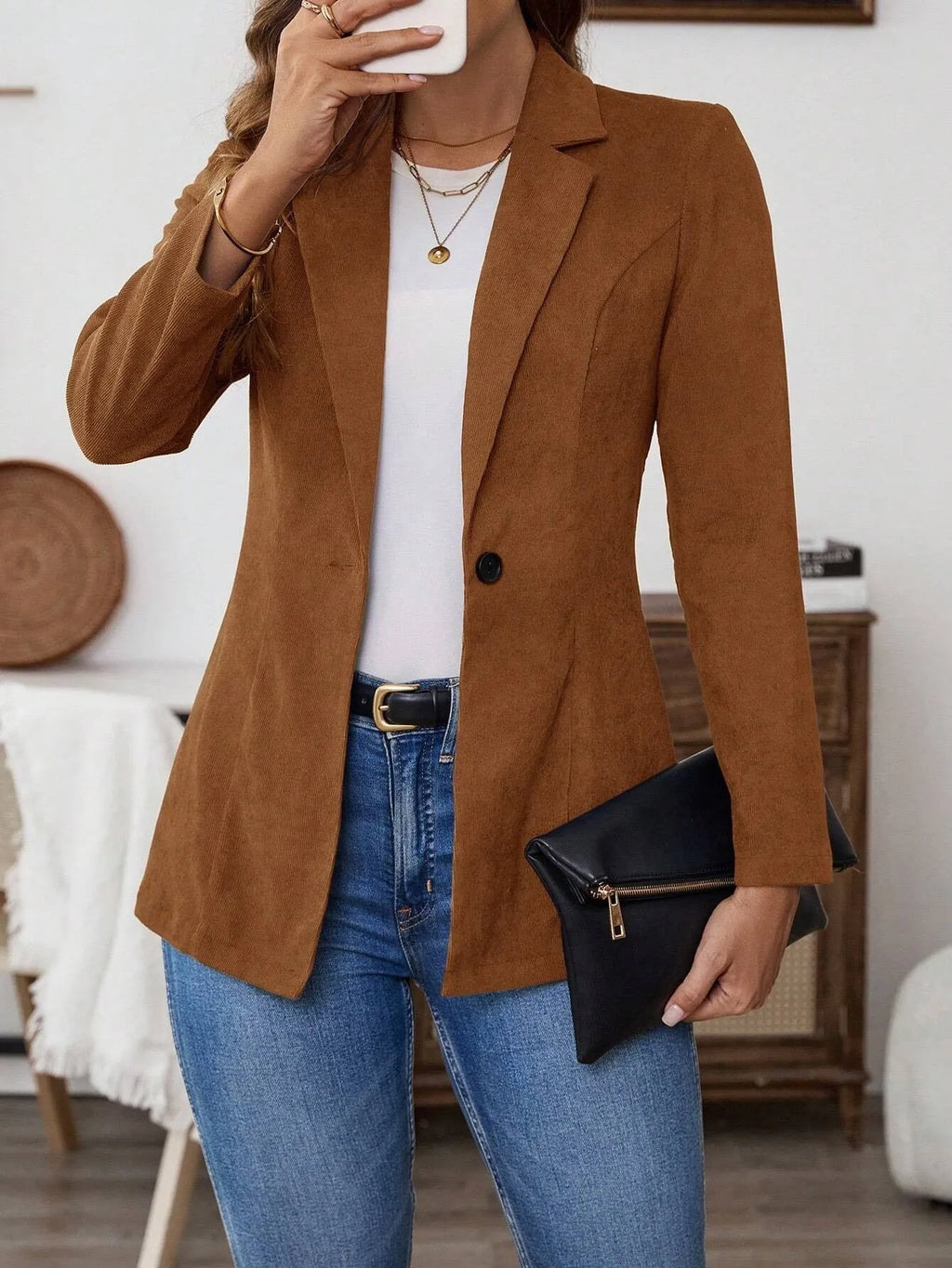 Brown men's single-breasted lapel collar coat with long sleeves on hanger