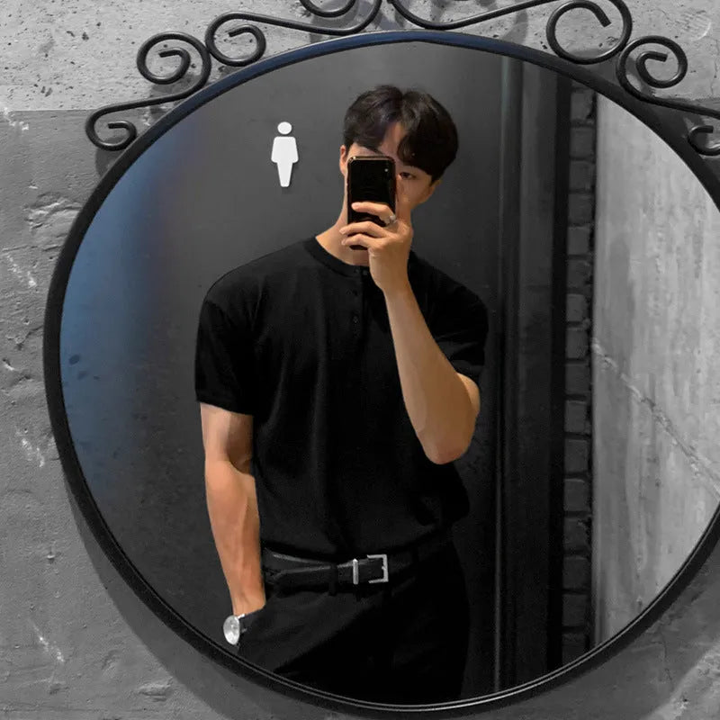 Men's slim-fit short-sleeved ice silk knitted shirt in black on a hanger.