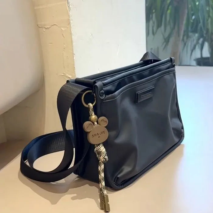 Niche High Sense unisex casual trendy cool retro Oxford cloth small square crossbody bag, single bag without ornaments.
