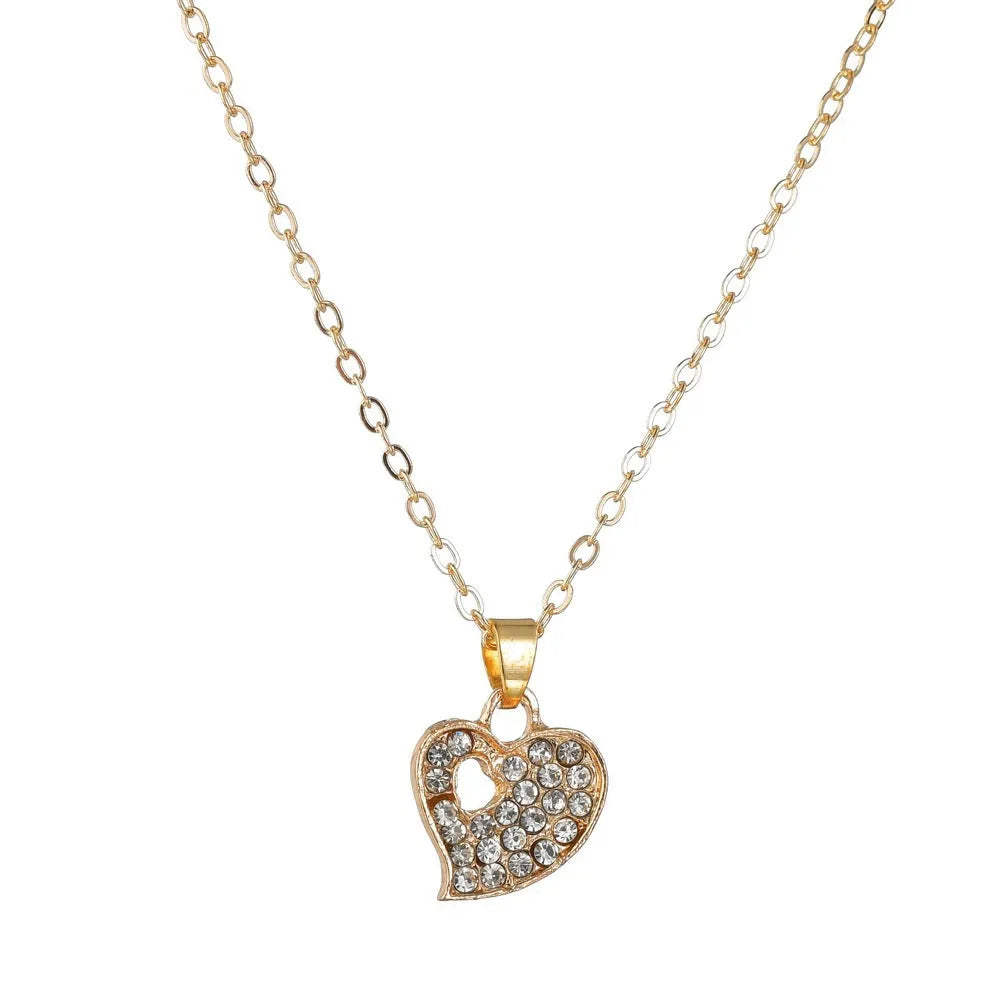 Gold electroplated alloy jewellery set showing earrings, pendant decoration, and hand decoration accessories