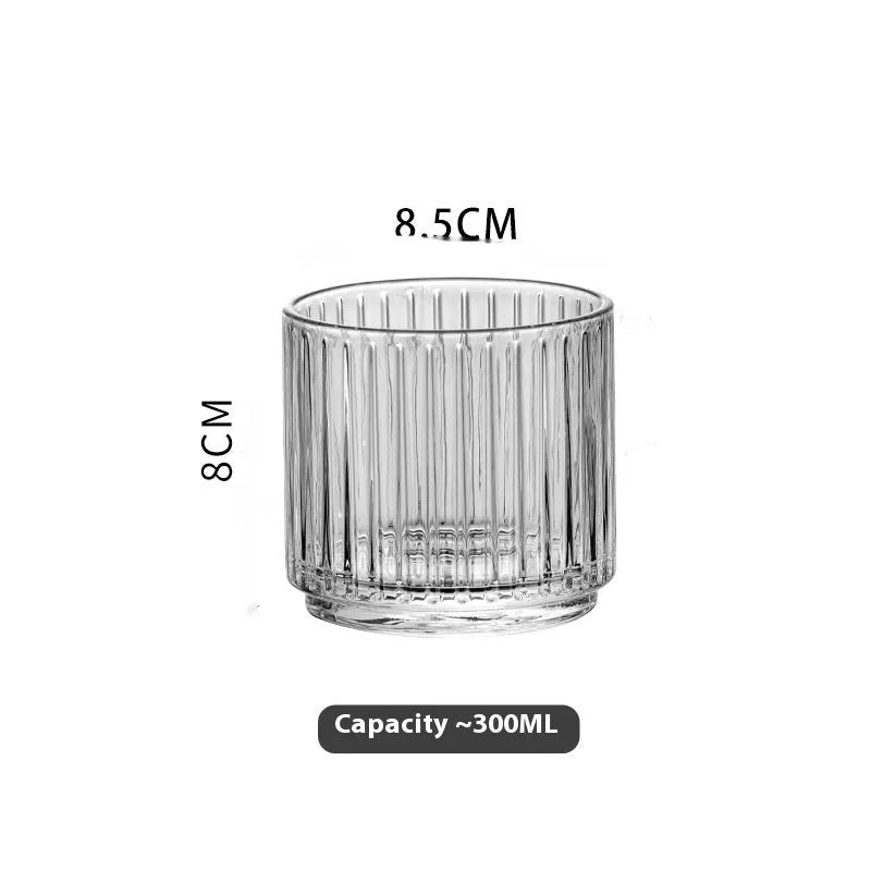 Clear glass cup and pot set with striped and diamond pattern designs for whiskey or wine