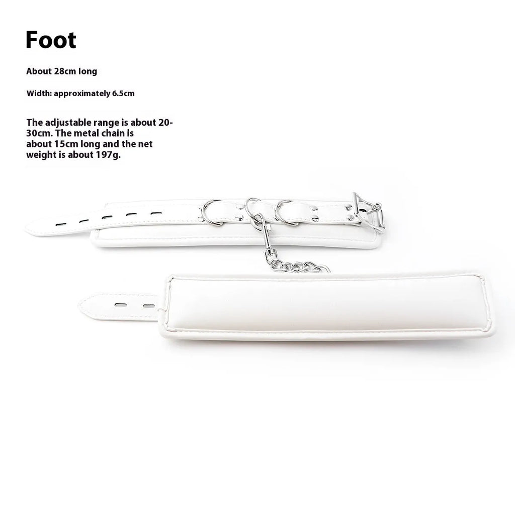 White PU sponge bondage set showing handcuffs, foot cuffs, and a neck cuff on a neutral background.