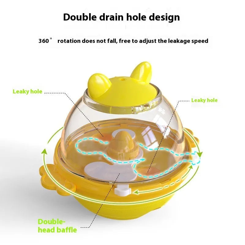 Yellow TPR dog tumbler food feeder toy on a light background, 11.2 cm high