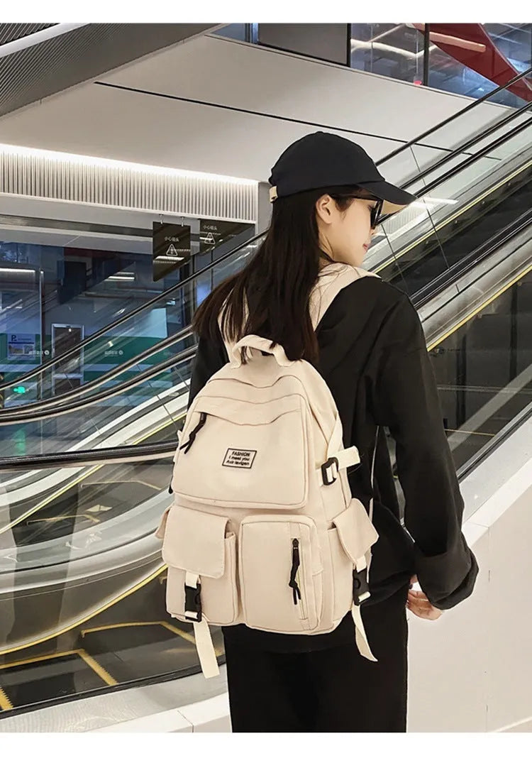 Soft nylon student backpack with computer compartment and three-dimensional pockets in black colour