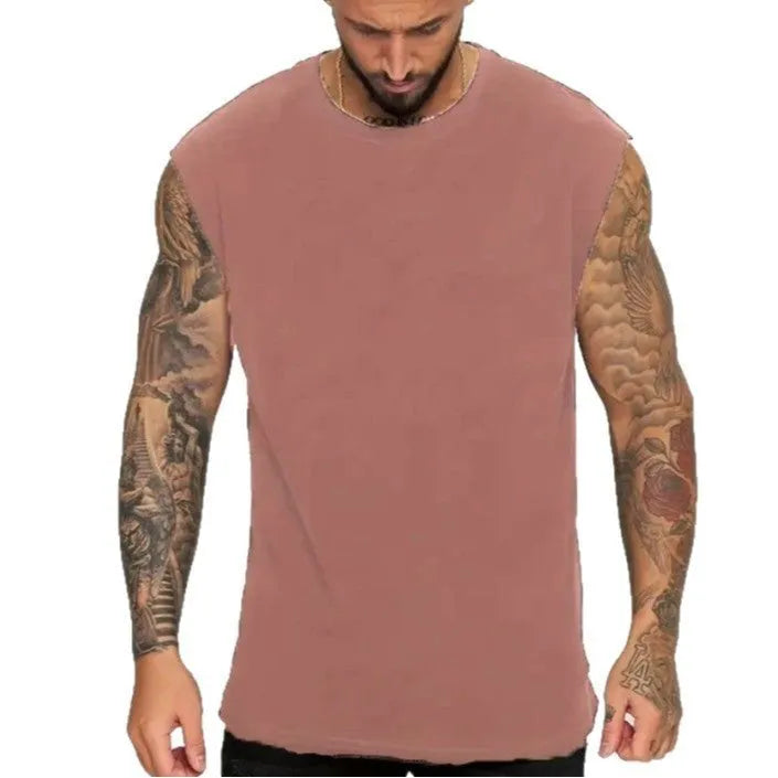 Men's loose sleeveless cotton t-shirt in a solid colour on a hanger.