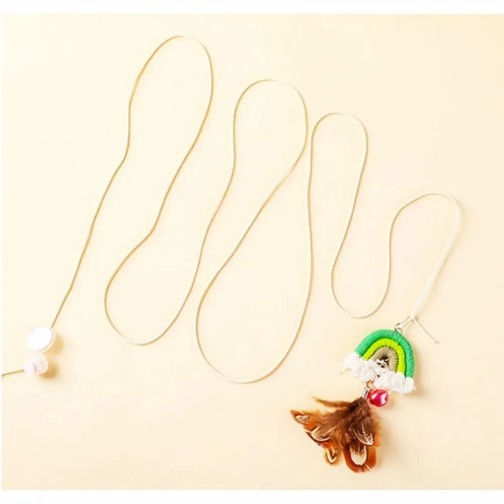 Blue feather rope cat toy with elastic cord hanging from door with sticky buckle clamp