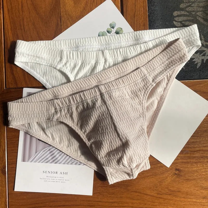 Men's cotton triangle briefs in solid colours with mid waist design showing apricot, black, white and skin colour options