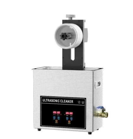 Compact single-slot ultrasonic cleaning machine for vinyl records and printed circuit boards on a workbench.