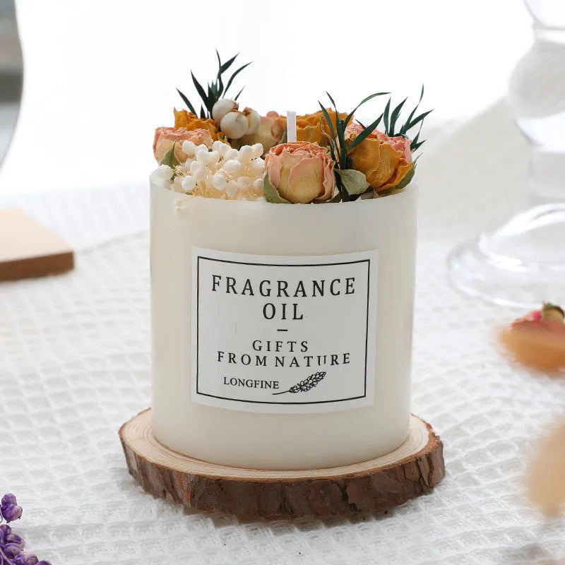 Aromatherapy candle with dried flowers on top, shown in various scent style options.