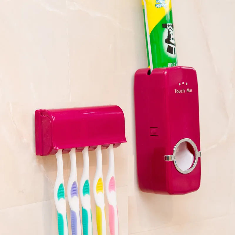 White plastic and silicone bathroom accessories set with toothbrush holder and pump dispenser on a tiled wall