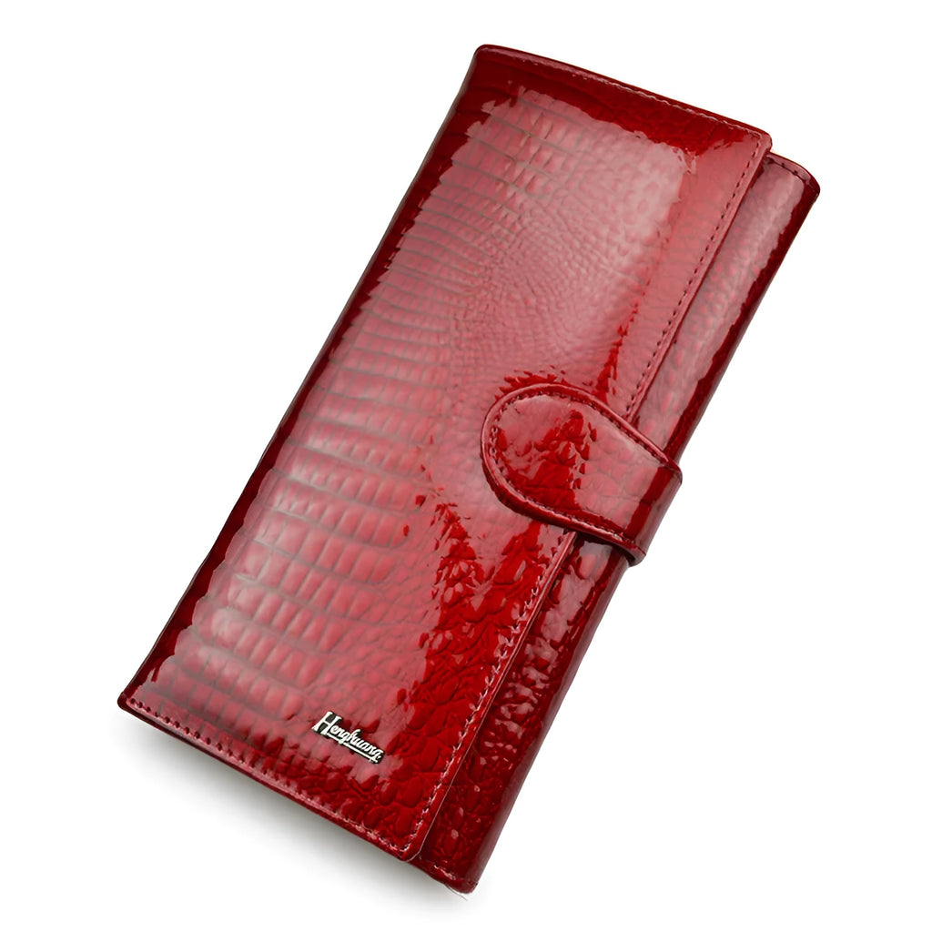 Red crocodile pattern patent leather women's coin purse with pigskin lining.