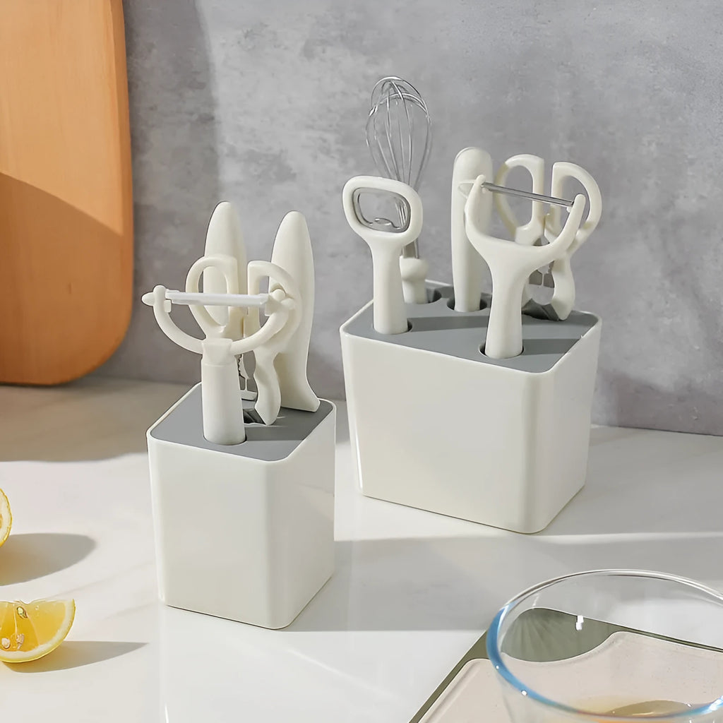 Six-piece white stainless steel kitchen gadget set with modern simplicity design on a clean surface