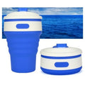 Collapsible silicone travel cup in grey, folded to 6 cm height, with anti-hot handle and leak-proof cover