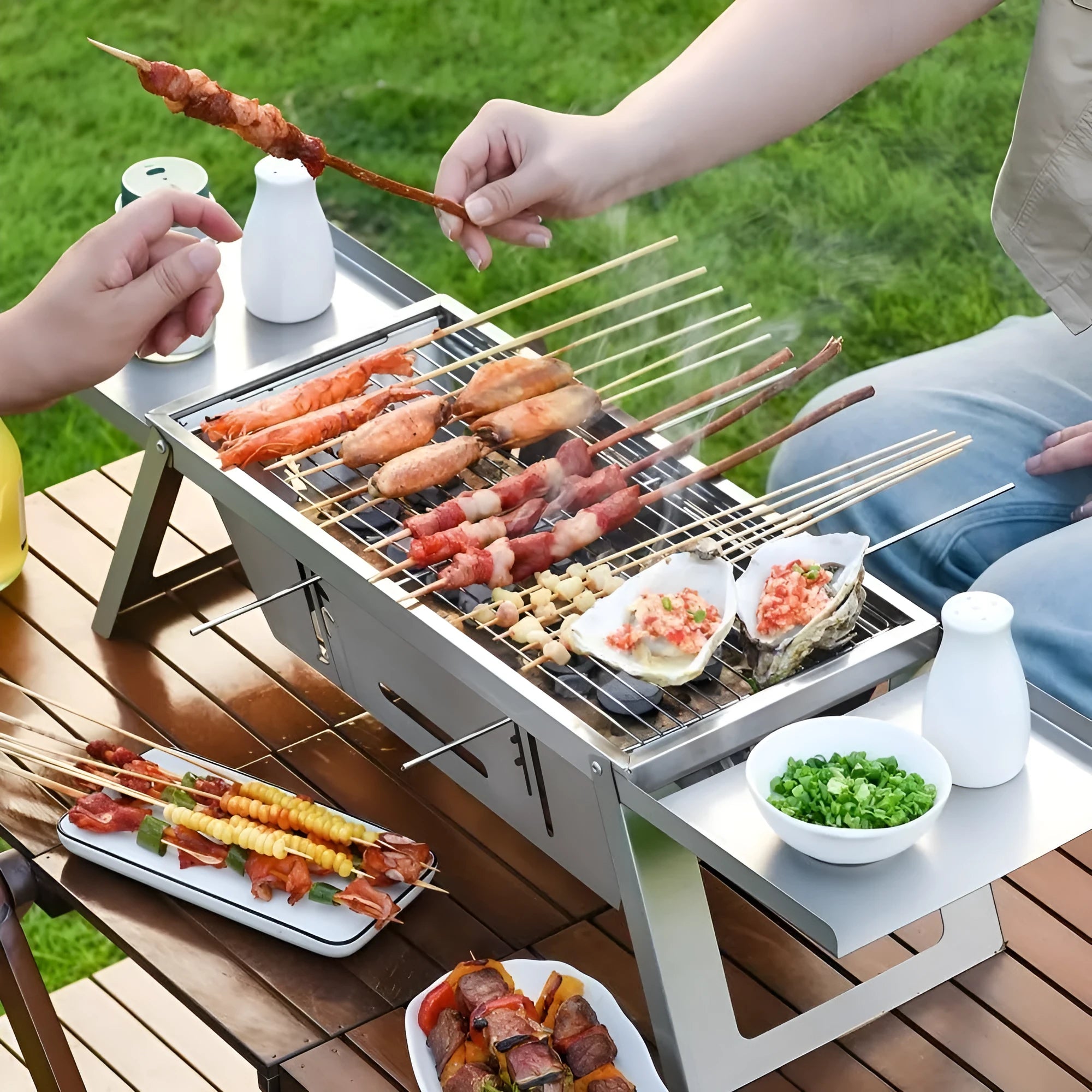 Small folding portable charcoal grill for outdoor barbecues, shown in use and folded for storage.
