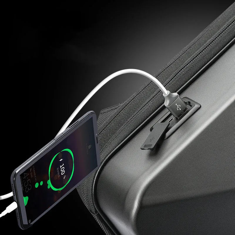 Large grey hard-shell gaming backpack with dual straps, showing lock and internal organiser pockets for computer and phone.