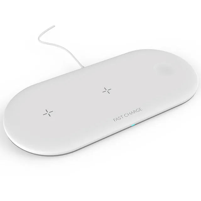 White three-in-one wireless charging station for Apple Watch, iPhone, and earbuds on a desk.