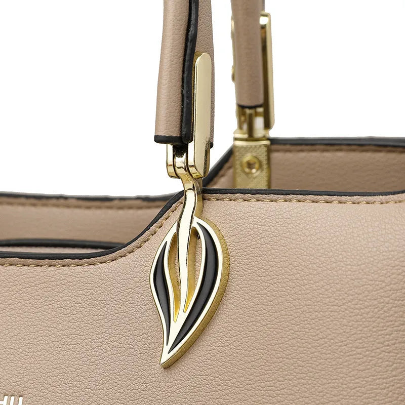 Women's black PU messenger bag with cross-body strap and multi-layer interior compartments.