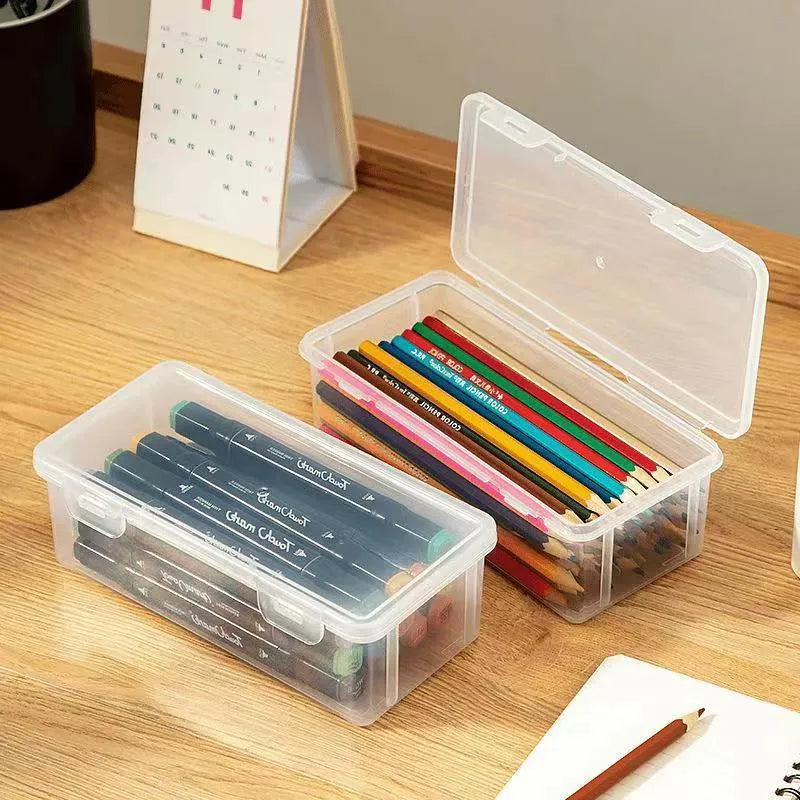 Large transparent plastic stationery storage box filled with colour pencils and crayons.