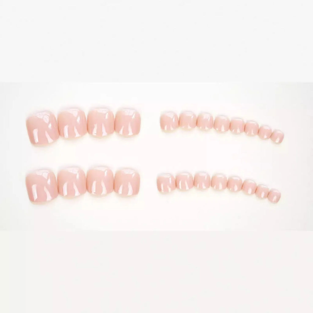 J-52 skin colour plastic false toenail stickers and glue set for cosmetic application.