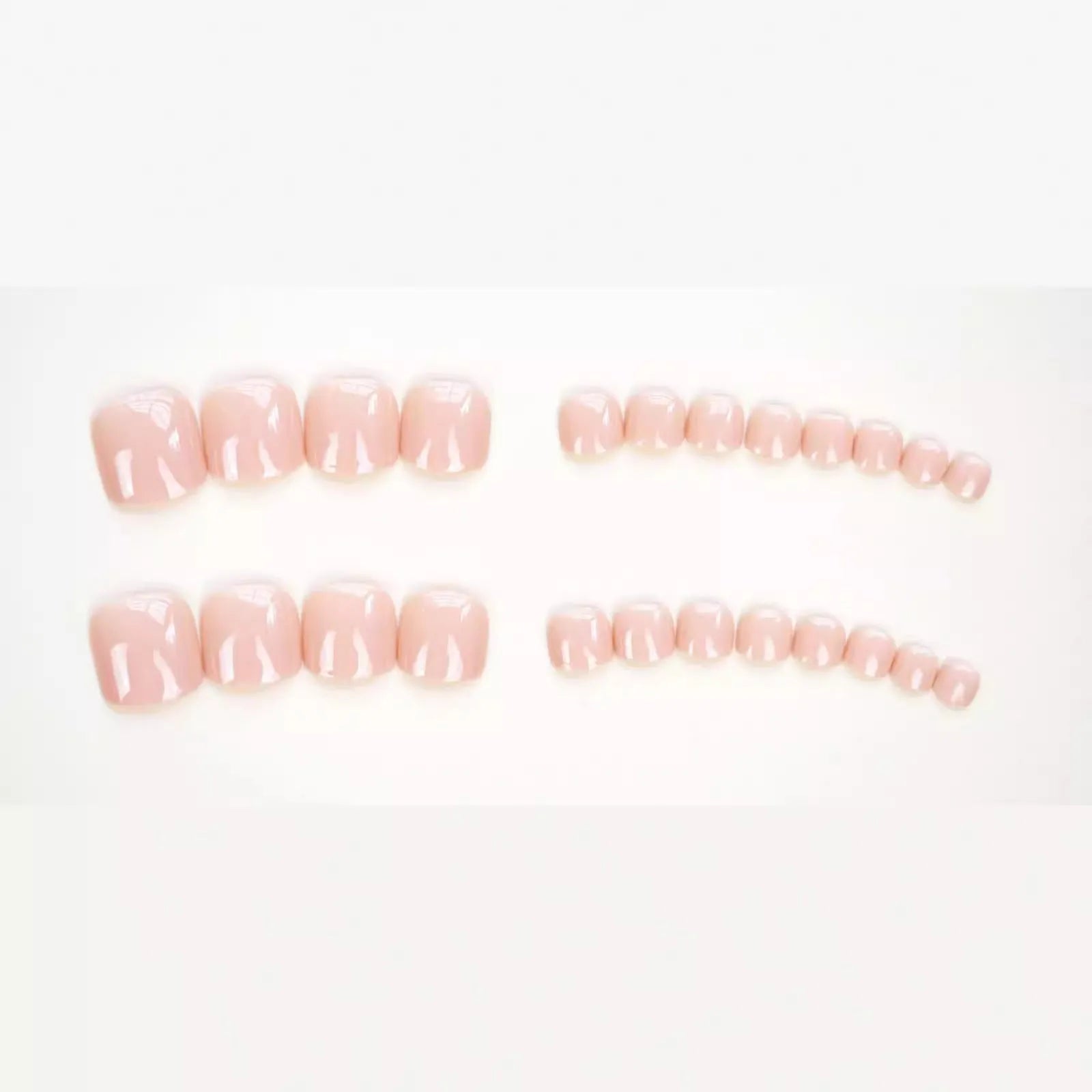 J-52 skin colour plastic false toenail stickers and glue set for cosmetic application.