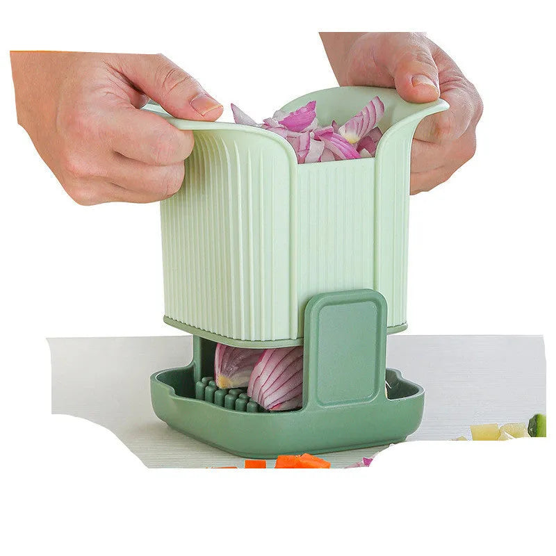 Green multifunctional vegetable chopper with hand pressure mechanism for cutting onions, potatoes, and cucumbers