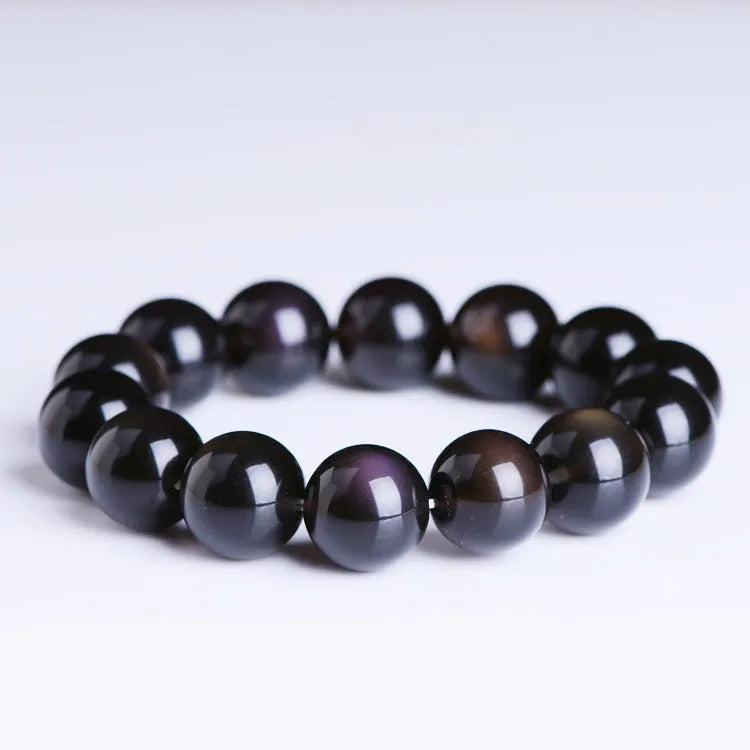 Genuine crystal icy obsidian Pi Xiu bracelet in geometric ethnic style on a neutral background.