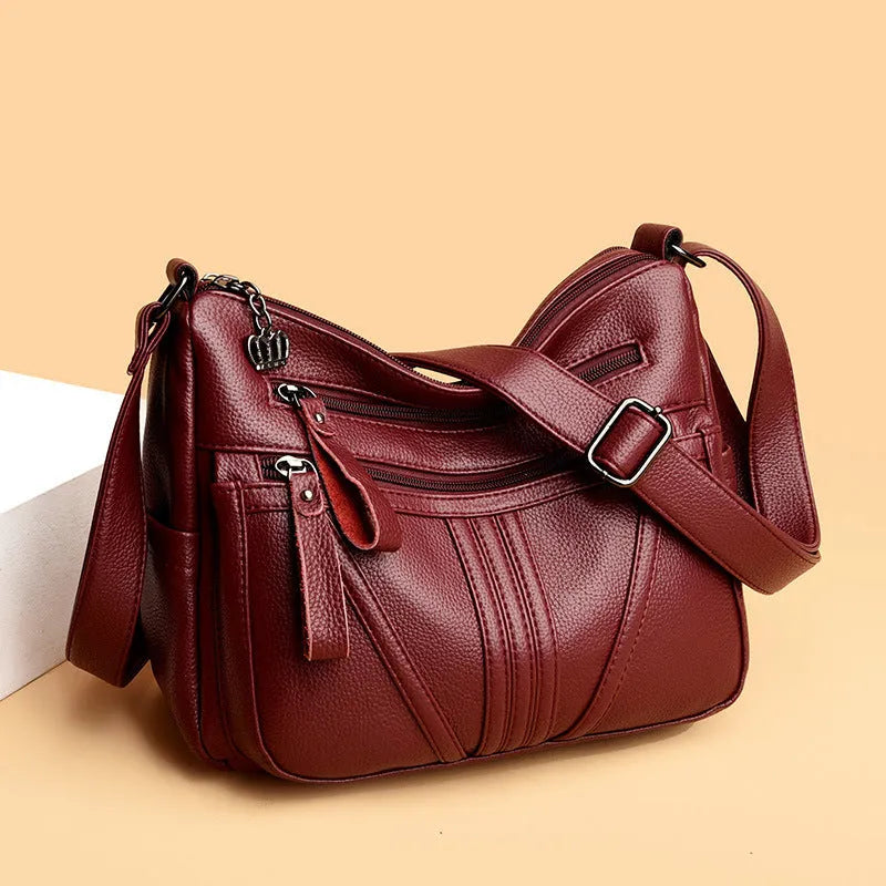Genuine leather horizontal square shoulder messenger bag with stitching and contrast colour details in black