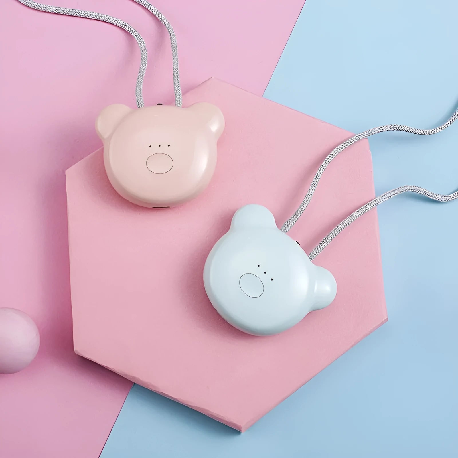 Mini USB rechargeable wearable air purifier necklace in pink, showing compact dimensions.