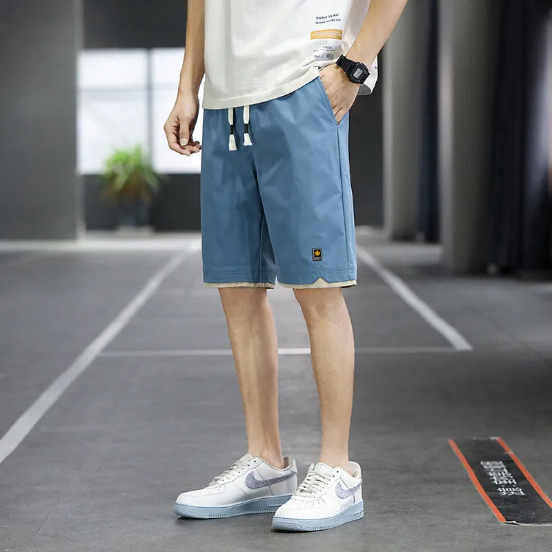 Men's loose straight fifth pants in green polyester fabric with South Korea style casual design