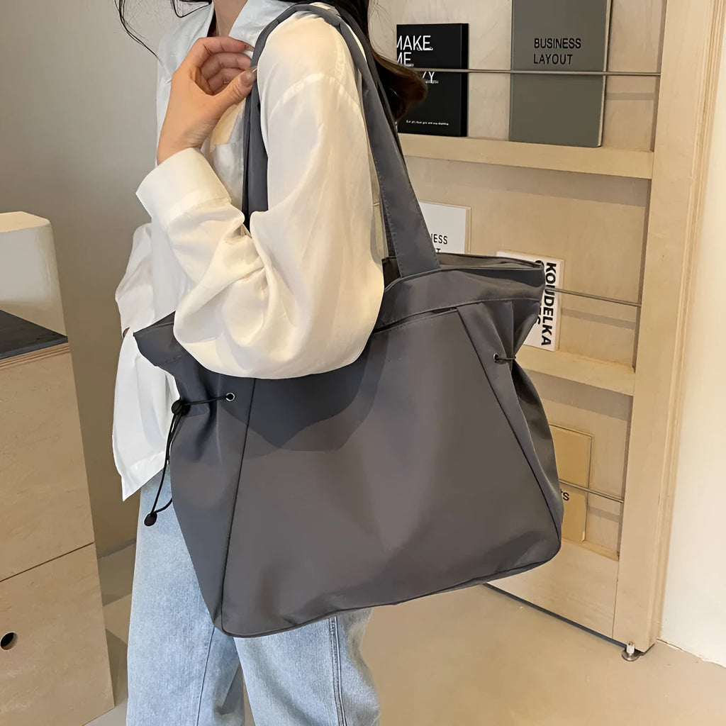 Folding Oxford cloth shoulder tote bag in five colour options showing casual street style