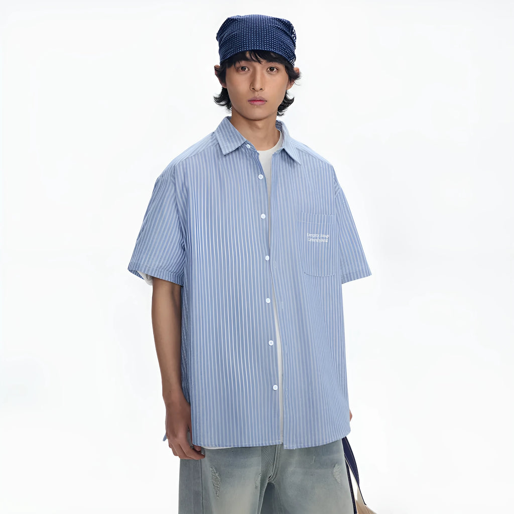 Blue and white striped loose-fit short-sleeved overalls shirt on a hanger