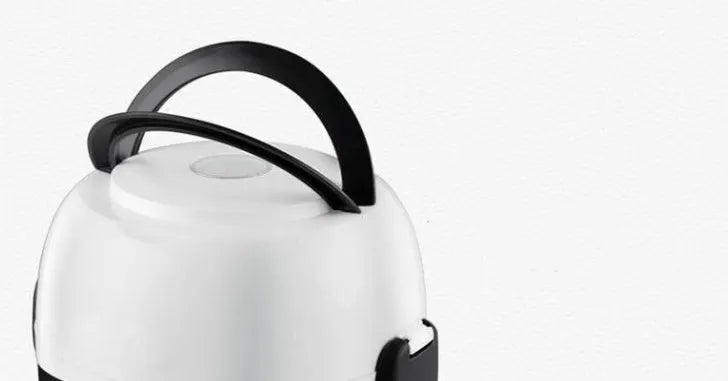 White 2L rice cooker with 200w power and 2-layer steaming option on a kitchen counter