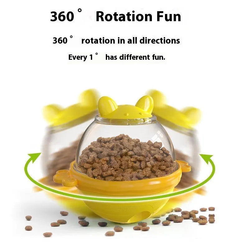 Yellow TPR dog tumbler food feeder toy on a light background, 11.2 cm high