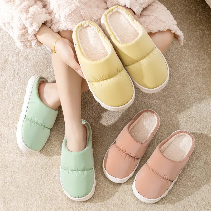 Blue winter house slippers with artificial leather upper, thick rubber sole, and plush lining.