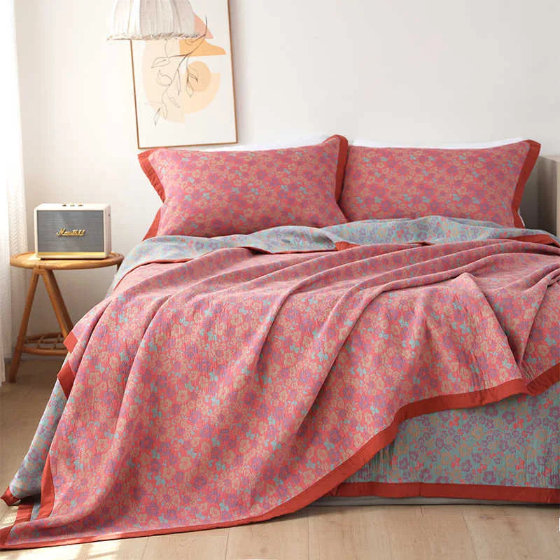 Three-piece cotton gauze bed blanket set with floral pattern showing blanket and two pillowcases