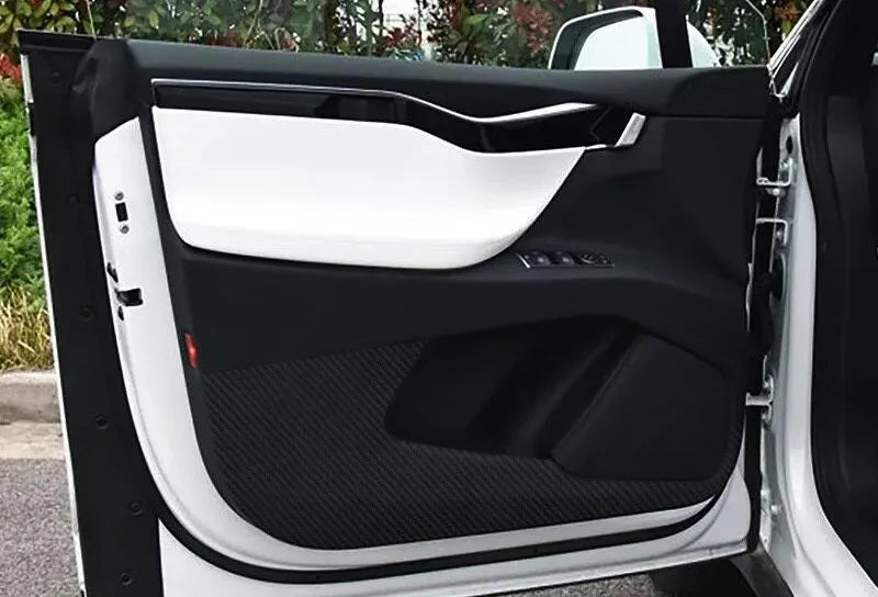 Four pre-cut clear protective films for Tesla Model S front and rear interior door panels.