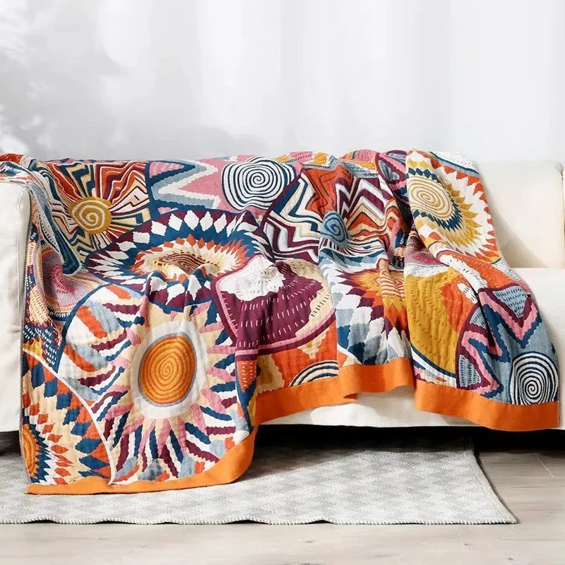Pure cotton five-layer gauze bed sheet blanket in Roulette Wheel Blue pattern, shown on a bed.