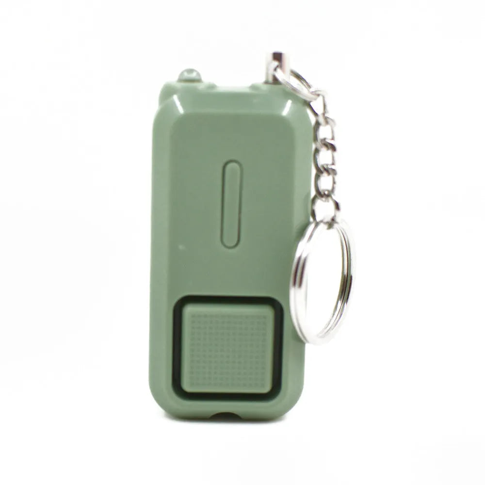 ZQ-202 personal safety alarm in pink, showing compact keychain-sized design.